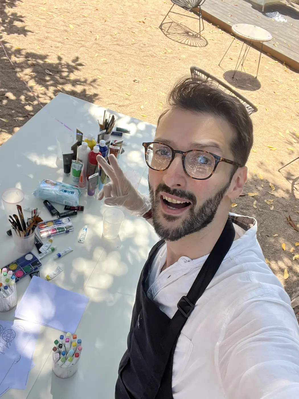 TK preparing materials for an outdoor creative activity